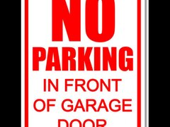 No parking in front of garage door sign